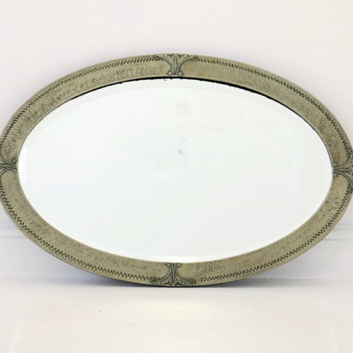 An Unusual 1920’S Oval Metal Framed Wall Mirror