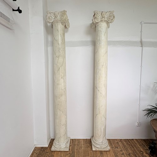 A Fine Pair Of Grand Columns With Ionic Capitals And Angels