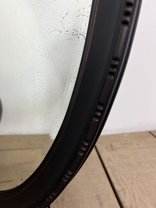 Antique Ebonised Painted Oval Foxed Mirror -vintage-boathouse-dc2f941d-f58a-43a4-a188-0d8db4f54766-main-638258402468169722.jpeg