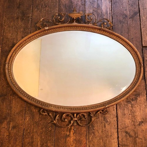 A French Gilt Wood And Gesso Large Oval Mirror 
